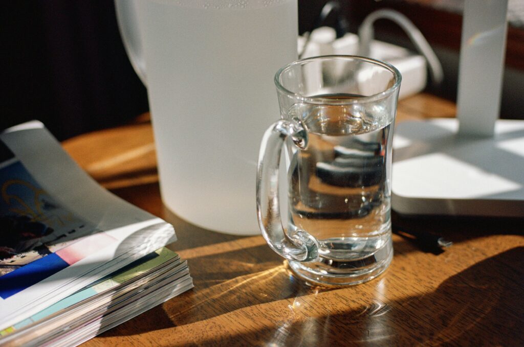 Glass of water on table– daily health habits