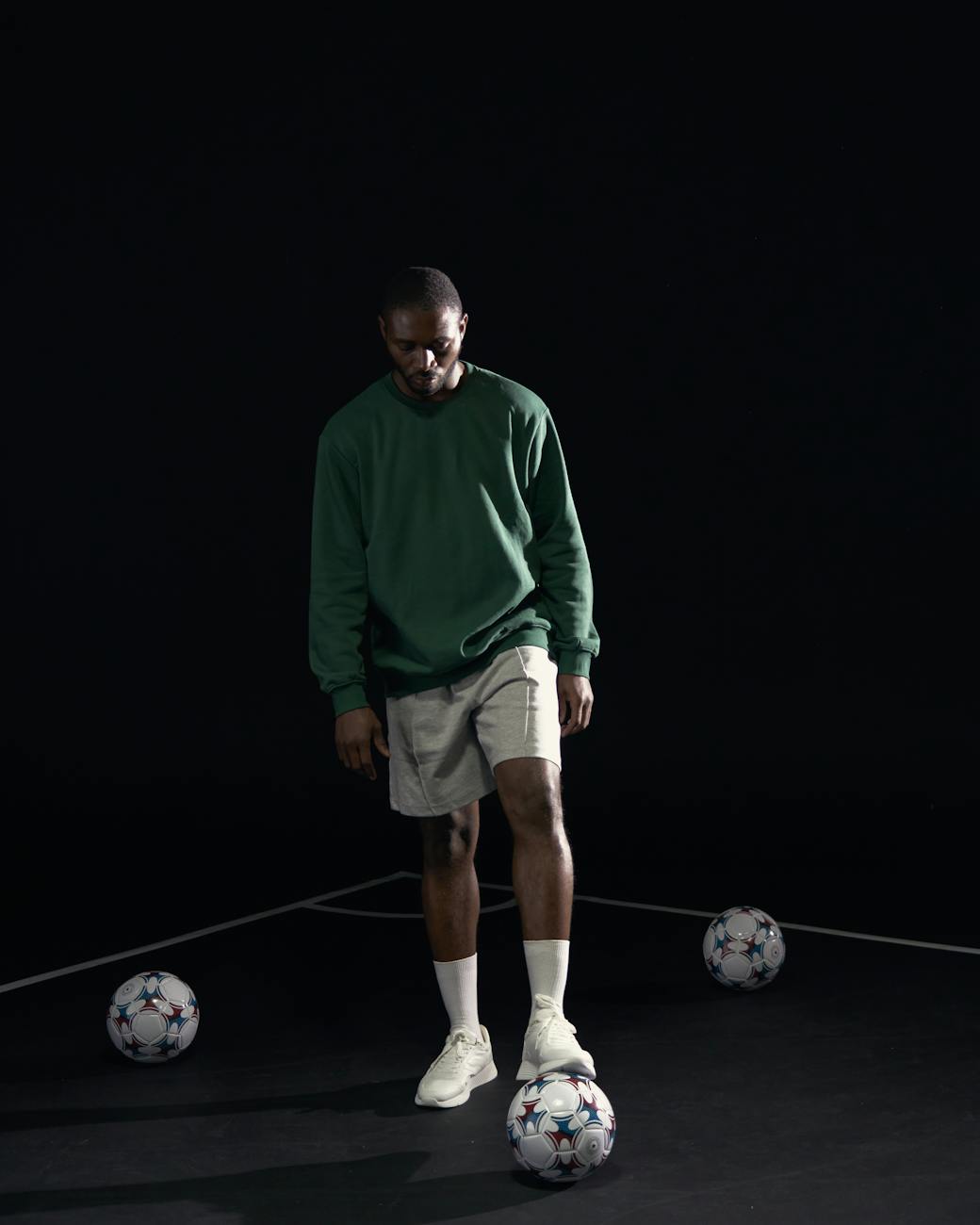 a man stepping on the football