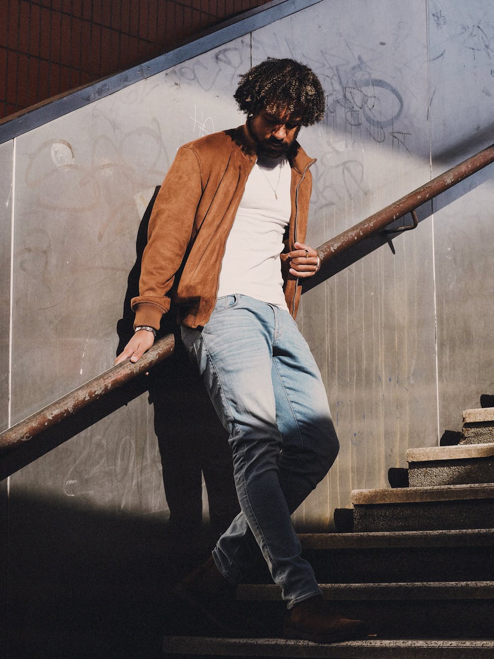 stylish young man on berlin staircase