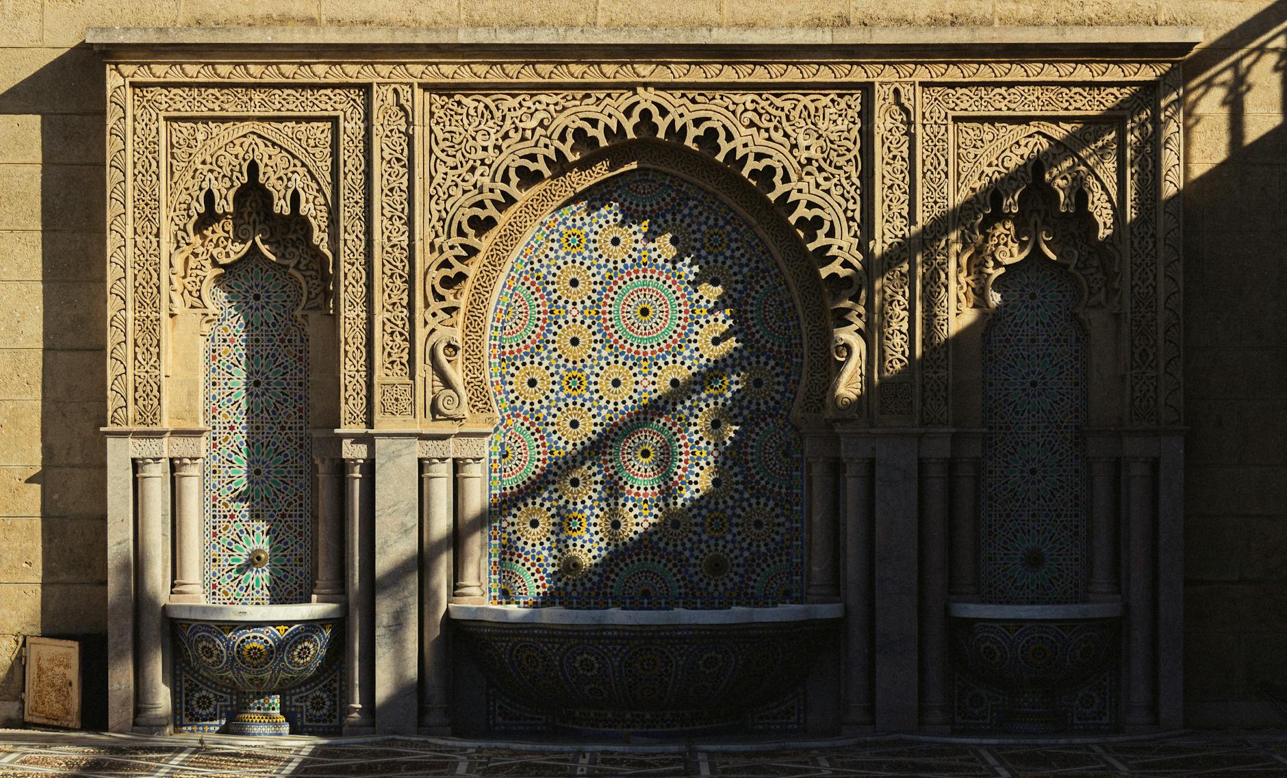 intricate moroccan mosaic fountain at sunset